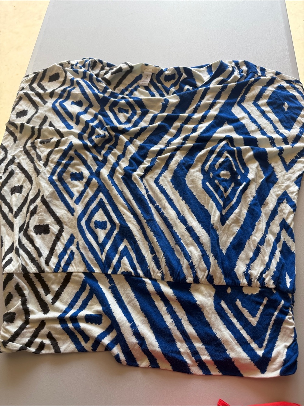 Woman’s Chico's Blue, Black and White Geometric Asymmetrical top, Size 2